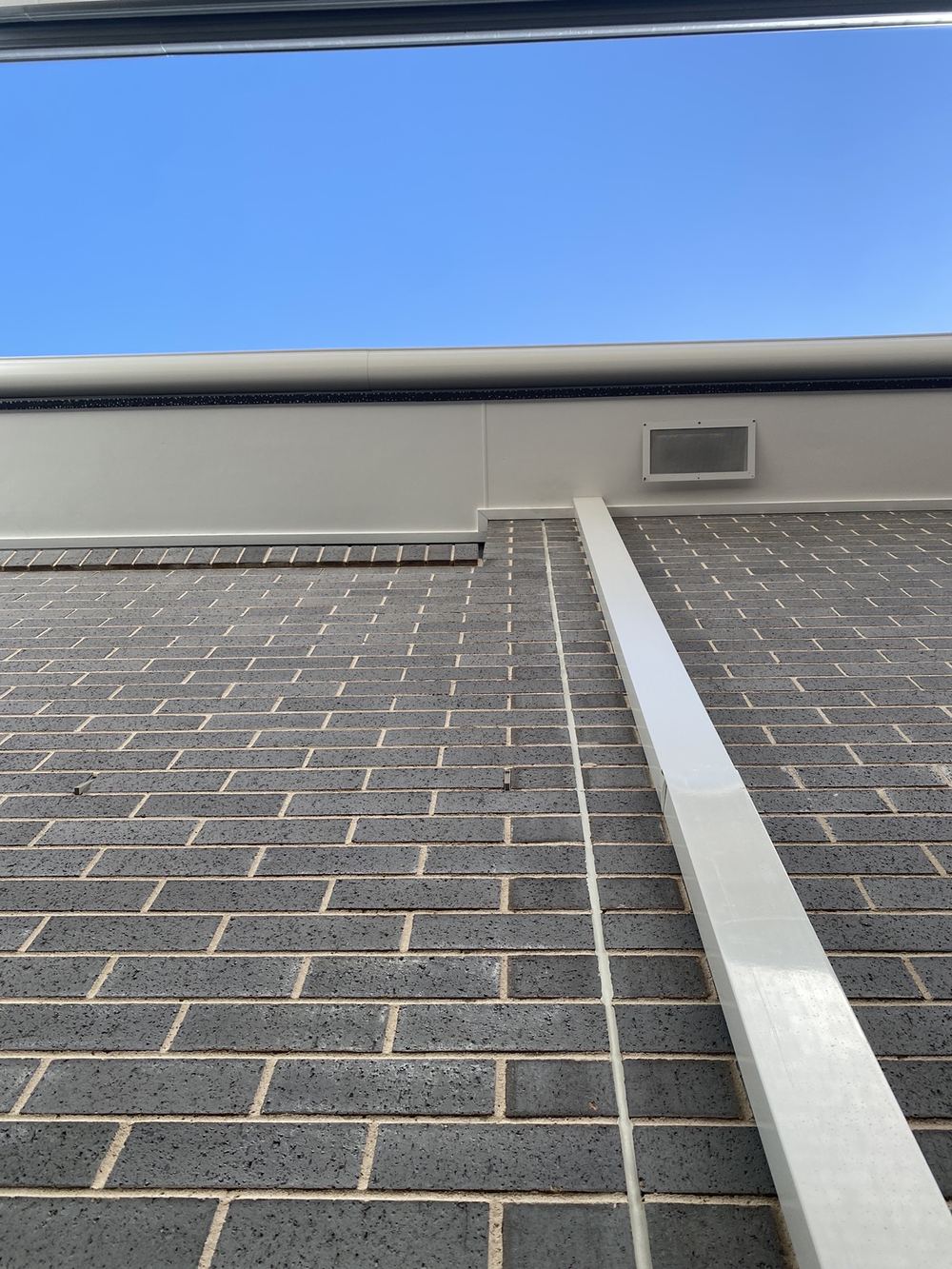 Articulation joint placed on the wrong side of an opening, away from the plans, found during a fixing inspection in Gables