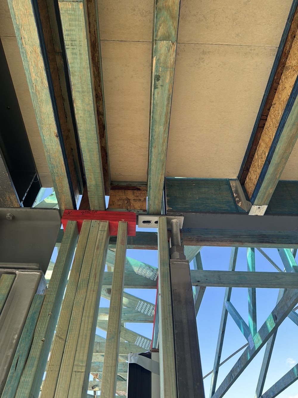 Steel beam support differing from the engineering, so it must be fixed or signed off, found during a frame inspection in Gables