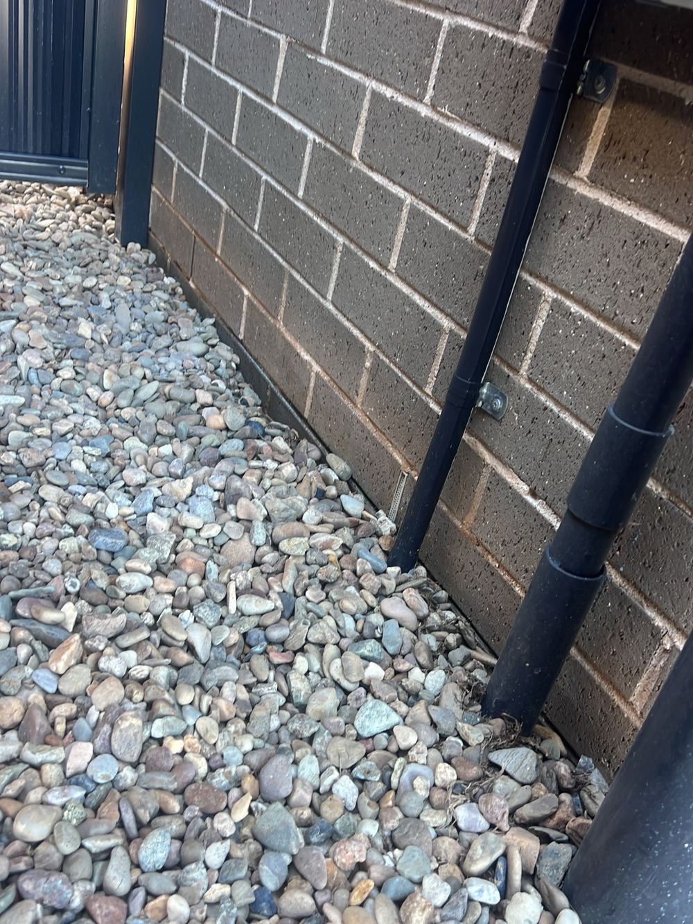 Ground still too close to the cladding at the reinspection, found during a handover inspection in Gables