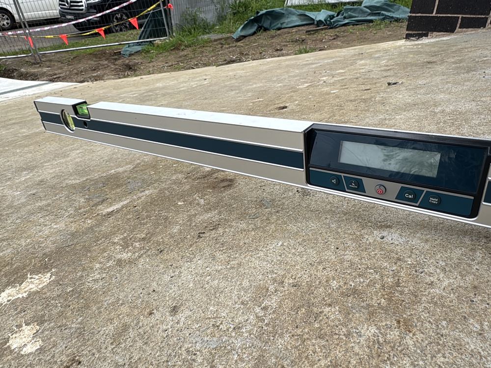 Abrupt gradient change at the top of a driveway, measured with a digital level, recorded during a defect investigation in Ermington