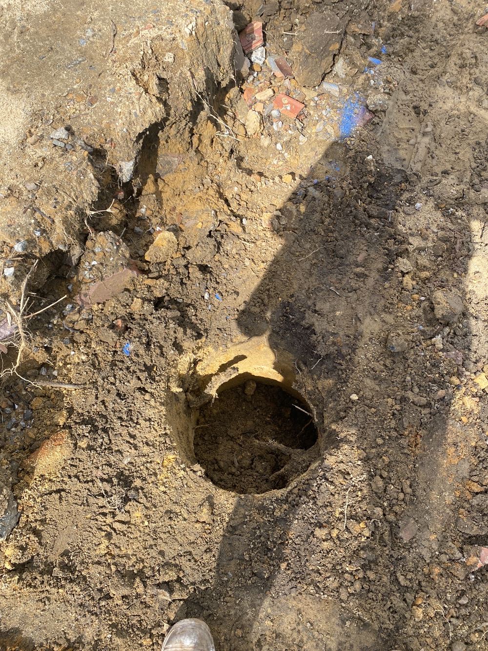 Loose spoil in the base of a bored pier, to be cleaned out before pouring, found during a bored pier inspection in Epping