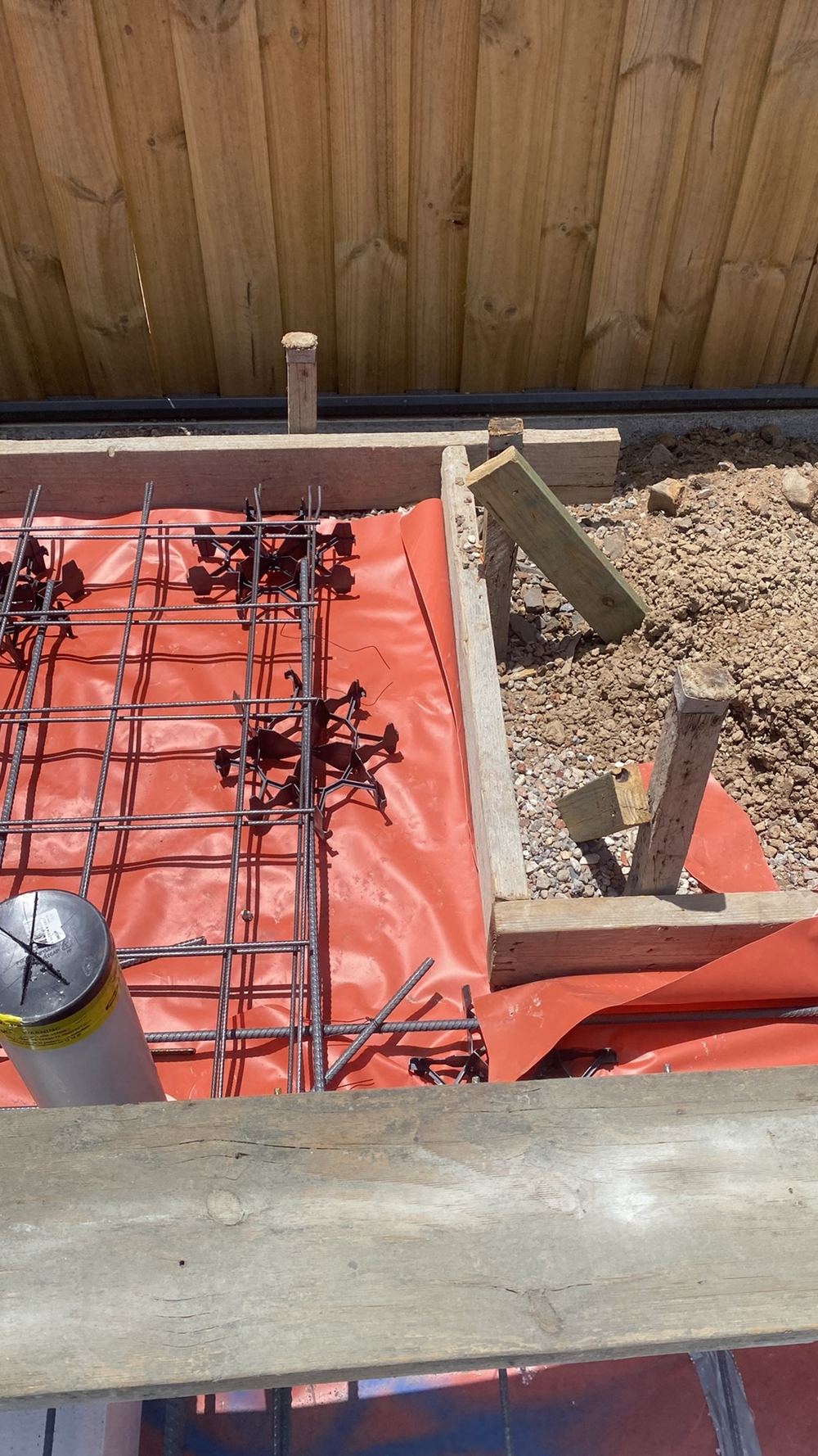 Reinforcement sitting too close to the form face, leaving too little concrete cover, found during a slab pre-pour inspection in Gables