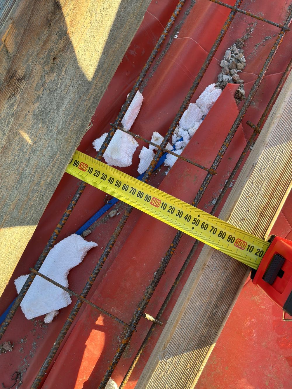 No extra reinforcement carried past a step in the slab, so the engineer must review it, found during a slab pre-pour inspection in Gables